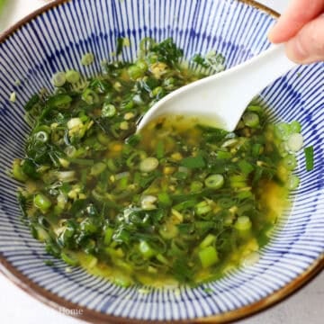 Pour hot oil over the aromatics.