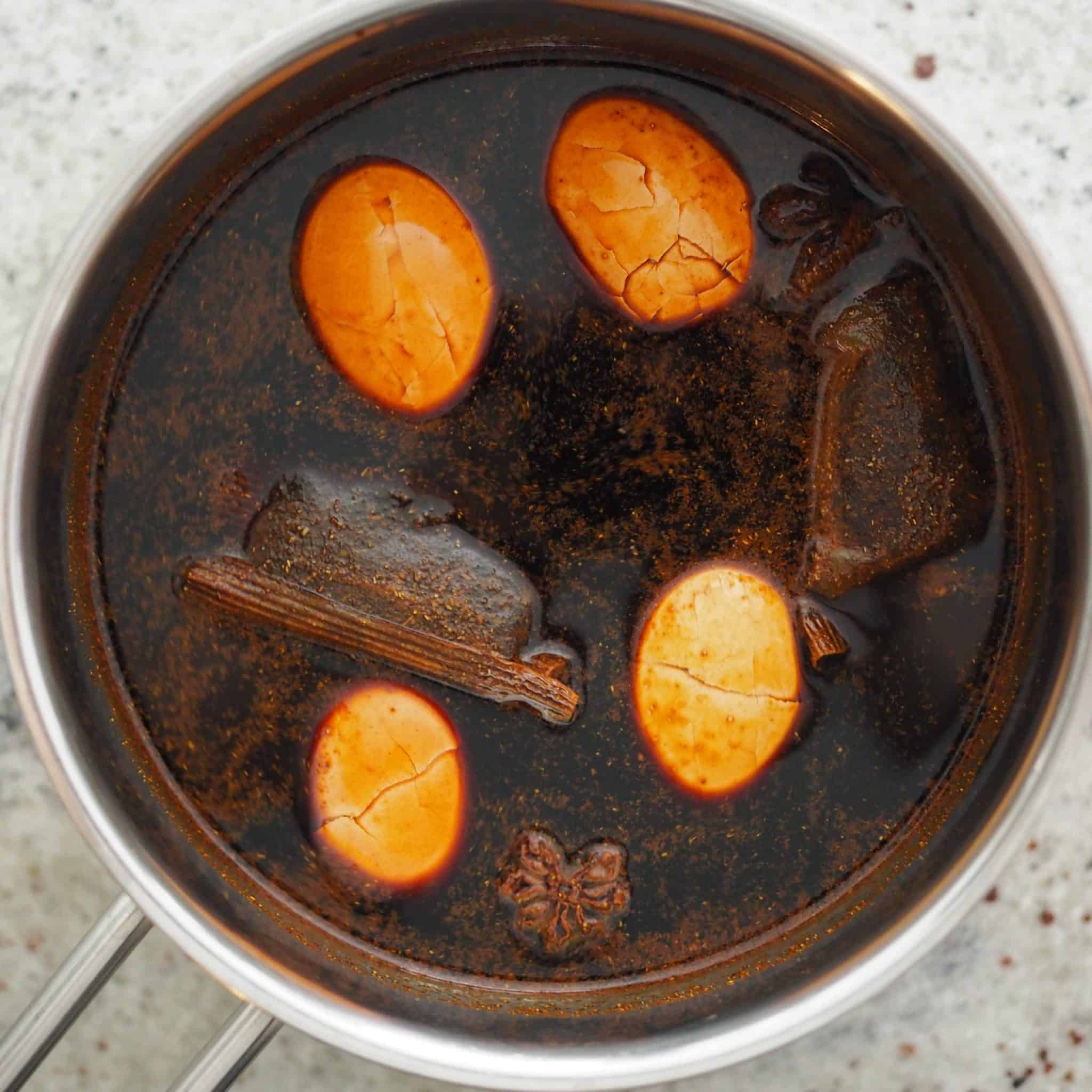 lightly crack the eggs with the back of a spoon and place into the empty pot