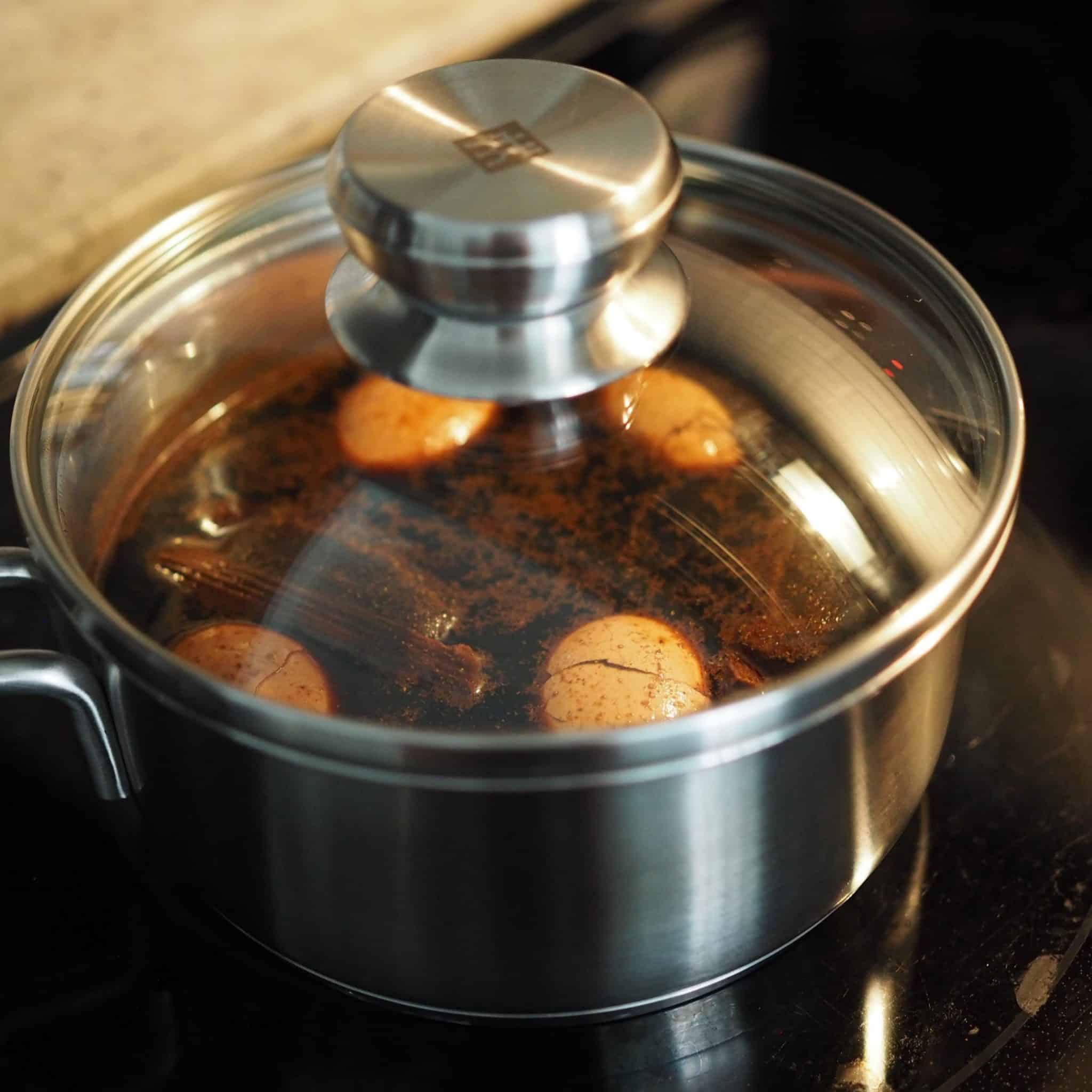 bring pot of eggs with marinade to a boil and reduce to a simmer for 40 minutes