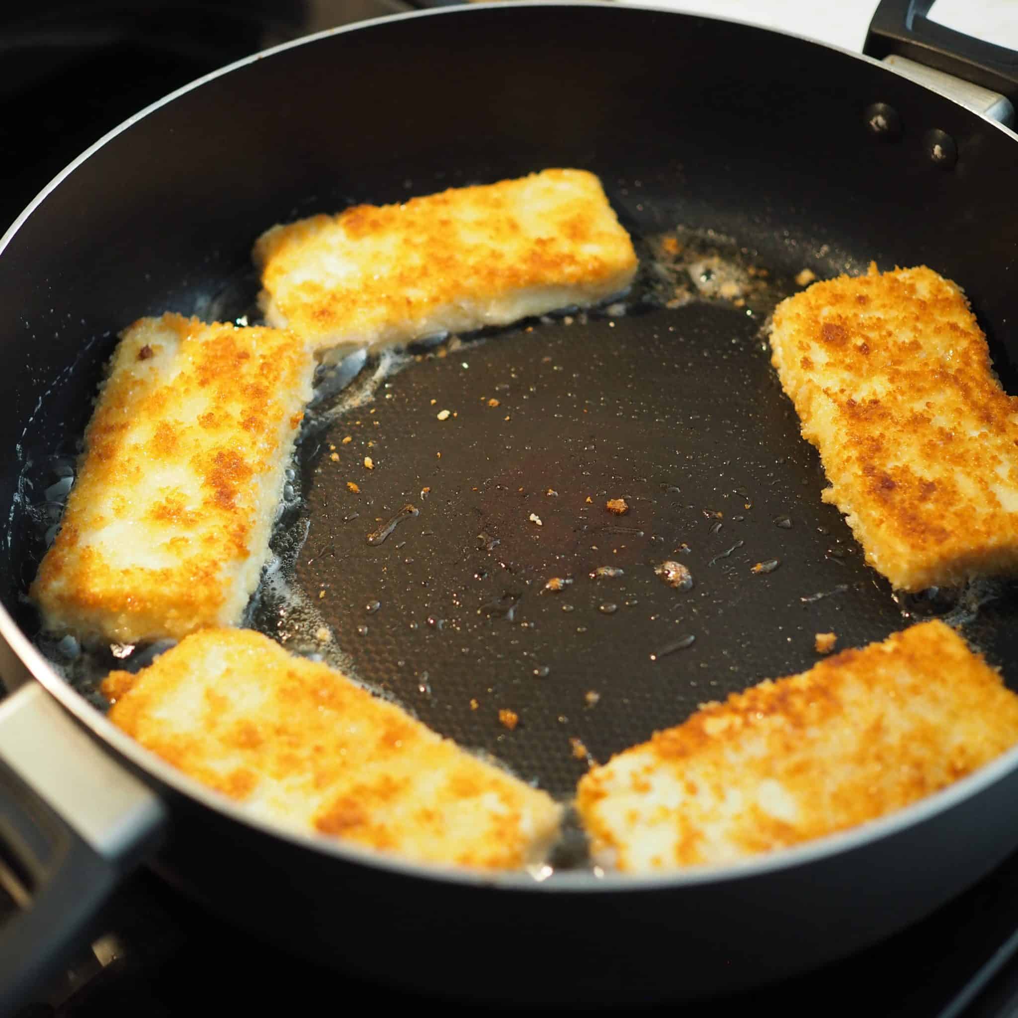 Heat vegetable oil in a large pan on medium heat. To test if oil is hot enough, place a wooden chopstick into the oil and if bubbles form then it's time to fry. Carefully lower breaded tofu into the oil and fry for 3 minutes on each side until golden brown. Remove from large pan and transfer to a wire rack or a paper towel lined plate to remove excess oil. Serve and enjoy!