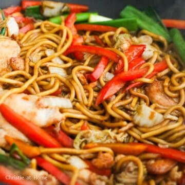 Add in the noodles followed by the noodle sauce. Toss until noodles are evenly coated in sauce. Add in the cooked chicken and green onions. Toss everything together until the sauce has caramelized and the noodles have absorbed most of it. Serve and enjoy!