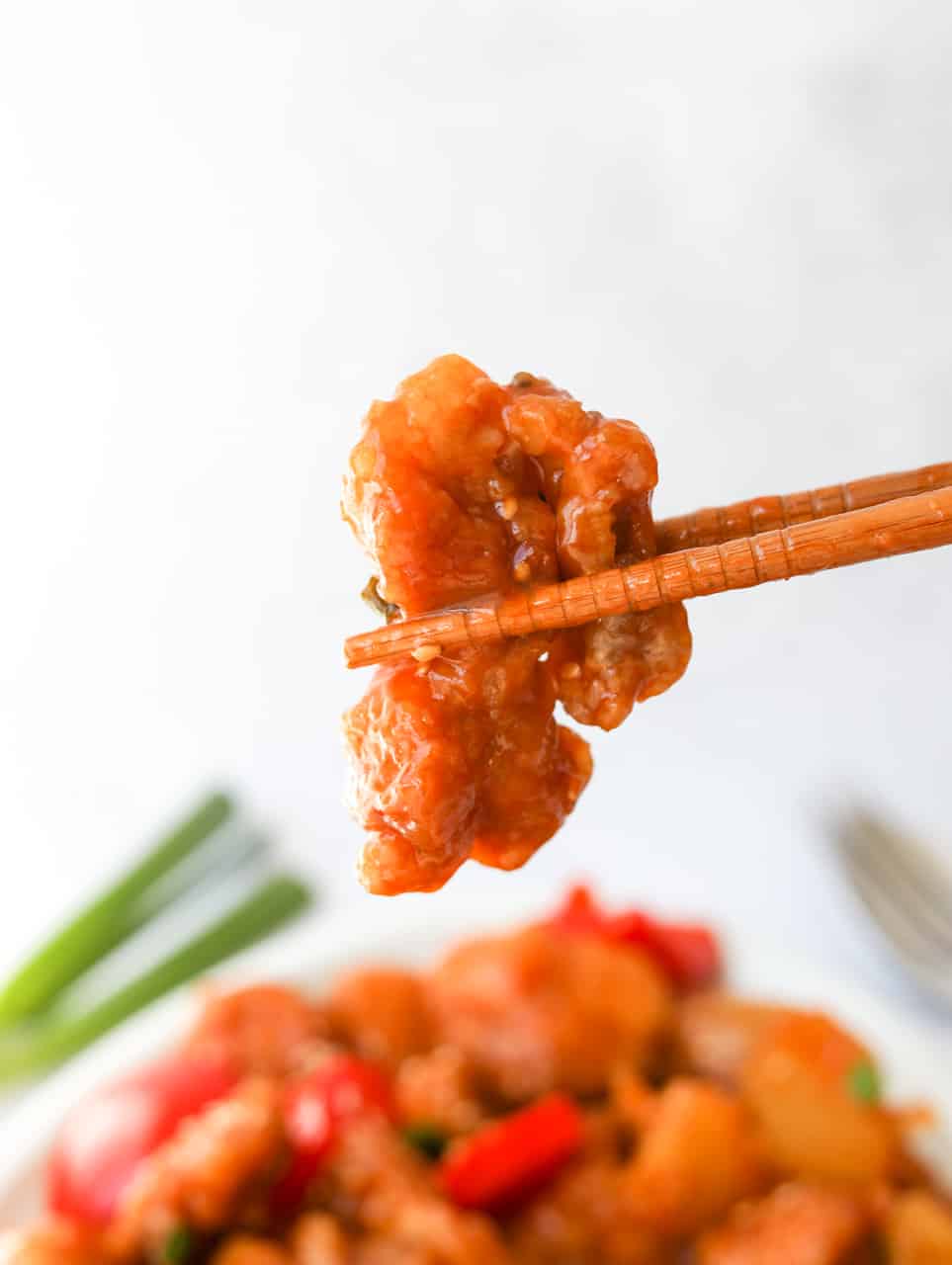 bite shot of sweet and sour chicken