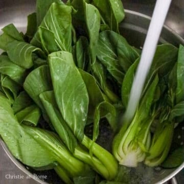 Slice regular or baby bok choy into halves. Wash in-between the leaves of your bok choy to remove hidden dirt, until water runs clear.