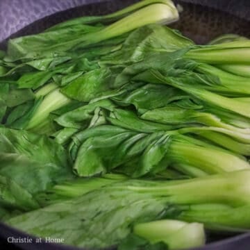 Fill a large pan or wok with enough water and bring to boil on high heat. Then blanch the bok choy until the leaves turn vibrant green, about 30-45 seconds. Strain immediately.