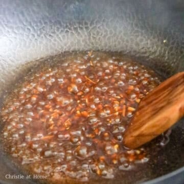 In a dry pan on medium heat, pour in the sauce and simmer to thicken.