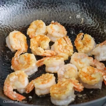 Then heat 3 tablespoon (45 mL) vegetable oil in a large pan on medium heat. Fry the shrimp on both sides just until pink, curled, and crispy, about 3-4 minutes. Remove and set aside.
