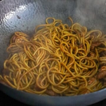 Add noodles and noodle sauce and toss to coat evenly.