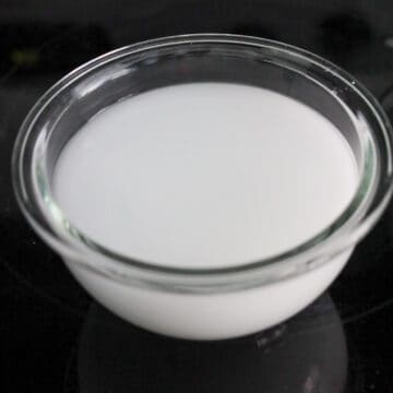 Combining sugar, cornstarch, and water in a small bowl and stirring until dissolved