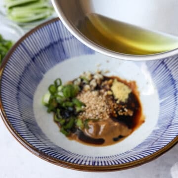 add hot oil to the bowl with the sauce ingredients