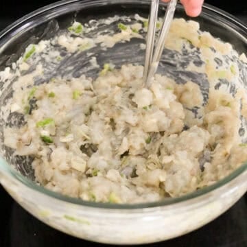Add remaining filling ingredients as listed above to the bowl with shrimp. Then mix in one direction with chopsticks or a fork until it forms a sticky paste. Alternatively, if you have a food processor, you can also add all your filling ingredients into the processor and pulse until it becomes a sticky paste.