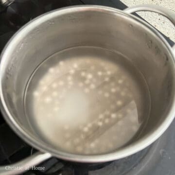 For large tapioca pearls: Bring a medium pot filled with 8 cups or 1.89 litres of water to boil on high heat. Add large tapioca pearls, reduce to medium heat and boil for 30 minutes uncovered. Turn off the heat, cover and let the pearls soak in the hot water on the heat source for another 30 minutes until soft and chewy by performing a taste test (even if you see a white dot in the center). If the center is still hard, repeat the whole process again until soft and chewy. For small tapioca pearls: bring a medium pot filled with 8 cups or 1.89 litres of water to boil on high heat. Add small tapioca pearls, reduce to medium heat and boil for 10 minutes uncovered. Then turn off the heat, cover and soak for another 10-15 minutes on the heat source, until fully translucent and the white dot is gone.