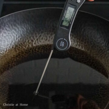 Heat vegetable oil in a large pan on medium heat to 350 F with a digital instant read thermometer. Or insert a wooden utensil into the hot oil and look for rapid bubbles.