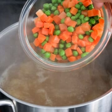Frozen mixed vegetables added to the broth and quickly heating until tender.