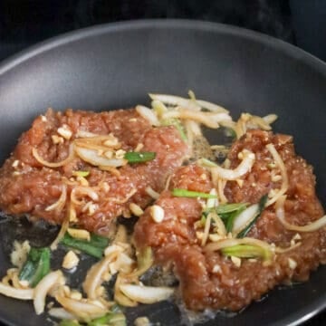 Heat vegetable oil in a large non-stick pan on medium heat. Pan fry the pork in small batches with some of the marinade, to avoid overcrowding the pan.