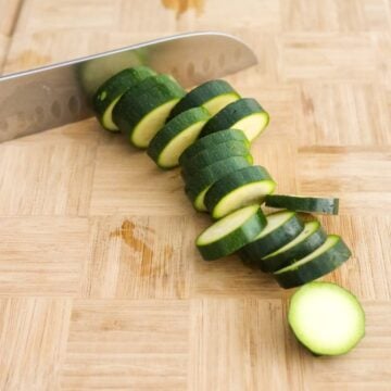 Slice the zucchini into ¼-inch-thick slices and remove the ends. Place sliced zucchini onto cutting board in a single layer.