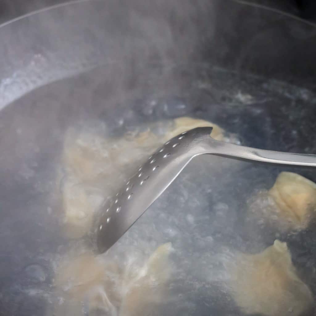 In a large pot of water, bring to a boil on high heat. Boil about 6-10 wontons at a time and stir immediately to prevent them from sticking to the pot. Boil uncovered for 2-3 minutes or until they float. Remove wontons with a slotted spoon and transfer to a medium bowl for serving. Serve with chili oil or dumpling dipping sauce and enjoy!