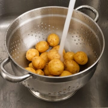 Rinse baby potatoes under cold water to remove any dirt. Do not peel.