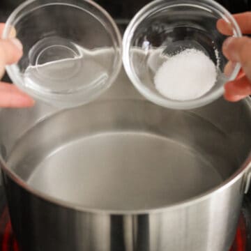 In a large pot filled halfway with water, bring to a boil over medium high heat. Optional: add salt and vinegar to the boiling water. The salt seasons the potato, and the vinegar allows the starchy potatoes to hold their shape better.