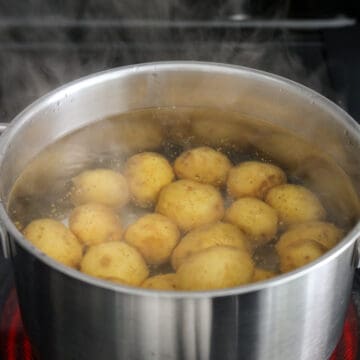 Boil baby potatoes for 20 minutes until fork tender, uncovered.