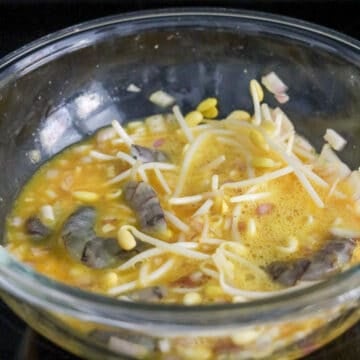 In a large bowl, crack and beat your eggs. Then add the rest of the omelette ingredients as listed to your beaten eggs. Mix well with chopsticks and set aside.Â