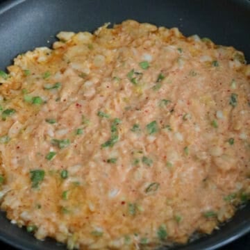 Heat 2 tablespoons of vegetable oil in a large non-stick pan (around 10-11 inches wide) on medium heat. Swirl the hot oil around the pan and then pour in the batter. Evenly spread the batter out with a spatula into a thin pancake. (Alternatively, if you want to make smaller pancakes, scoop one cup of the batter to fry and reduce the frying time to 2-3 minutes per side).