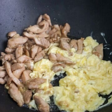 Pour in beaten eggs. Cook and scramble them. Move to the side of the pan.Â