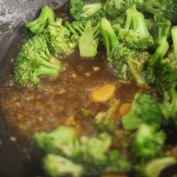 Push the broccoli to the side of the pan. Pour in stir fry sauce and simmer to thicken. Then mix with the broccoli.