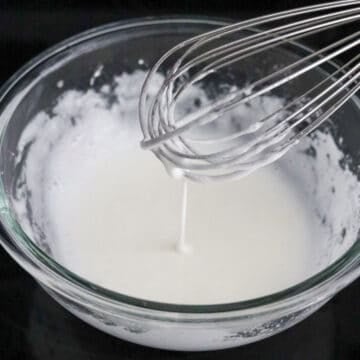 In a separate large bowl, add egg whites and whisk until foamy. They should just be foamy, not like a meringue. Add cornstarch and mix until you have a runny paste.