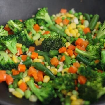 Add broccoli florets and mixed vegetables and stir-fry for 1-2 minutes.
