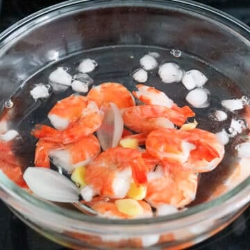 Strain out the shrimp and transfer to an ice bath with cold water to cool down completely.
