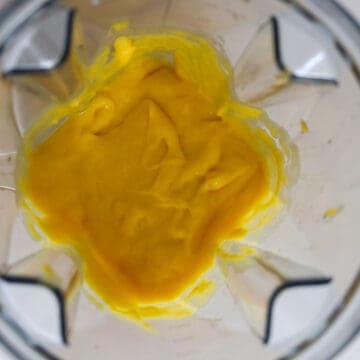 Blend two mangos with the condensed milk in a blender until smooth.