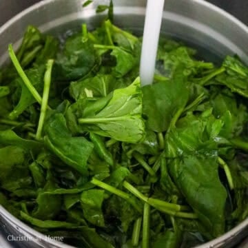 Wash spinach until water runs clear