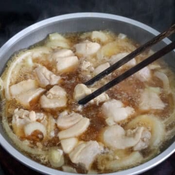 Spread diced chicken across the pan in a single layer. Simmer chicken for 2 minutes. Flip chicken pieces over.