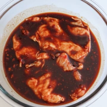 Pat dry the chicken thighs with clean paper towels. Debone chicken thighs by making small sharp slits around the bone until you can easily remove it but leave the skin on. Transfer thighs to a large bowl with the marinade and submerge the thighs into it. Cover with a lid and marinate for at least 15 minutes in the fridge. For the best results, marinate overnight.