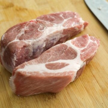 Slice pork into two long equal sized pieces. When you cut, try to cut in a way that both parts will equally contain enough fat marbling through it.