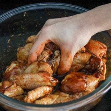 Add Marinade ingredients into the bowl and massage into chicken until coated.