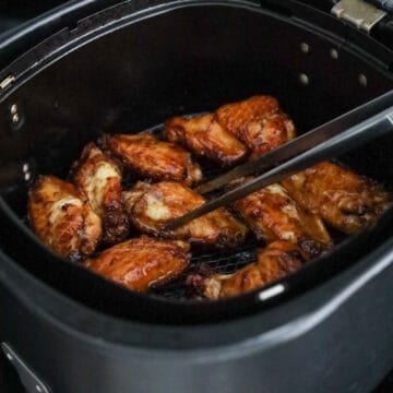 Air fry for 8 minutes at 400 degrees F on one side. Flip the wings over and air fry for 4-5 minutes on the other side.
