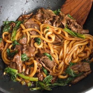 Toss in the beef and stir fry for another minute until beef is cooked through. Serve and enjoy!Â