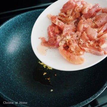 Heat extra-virgin olive oil in a large pan on medium heat and cook and chicken with minced garlic for 5-7 minutes until the chicken is 50% cooked.