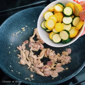 Add sliced zucchini into the pan and sauté until it has softened.