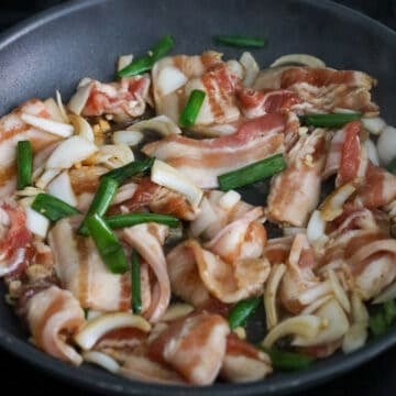 In a large skillet over medium heat, add pork along with marinade ingredients.