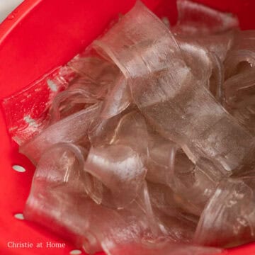 Strain the noodles in a colander and set aside.