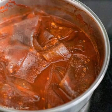 When the sauce begins to boil, mix in the cooked glass noodles and cook for 3-4 minutes. Serve the noodles with your favourite toppings and enjoy!