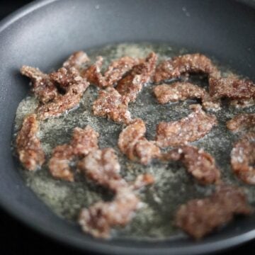 Heat vegetable oil in a large pan on medium heat and fry beef in small batches in a single layer for 1-2 minutes until crispy. Do not over fry. Remove cooked beef and transfer to a wire rack or paper towel lined plate to remove excess oil.