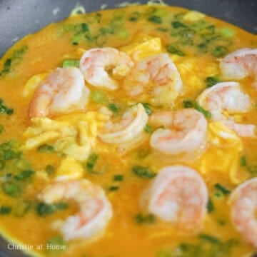 Reduce to low heat. Mix the egg mixture again before pouring it into the pan and let the eggs set in the pan, about 30-60 seconds.