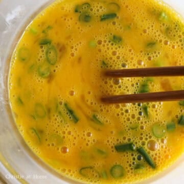 In a medium-size bowl, beat eggs, green onions, regular soy sauce, and sesame oil until smooth, or for 30 seconds.