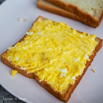 For one sandwich, use 4 pieces of bread. Place a slice of bread on a clean working surface. Then spread a layer of the potato egg mixture on top of it.