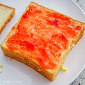 Cover the potato egg layer with a slice of bread. Spread jam on top of that slice.