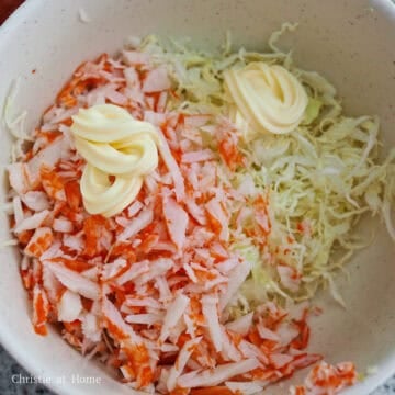 In a large bowl, combine shredded cabbage, chopped imitation crab with Japanese mayo until well combined. Set aside.