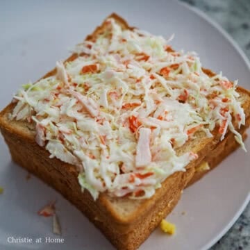 Place another piece of bread on top of the jam, spread the crab cabbage mixture on top and cover with another piece of bread.